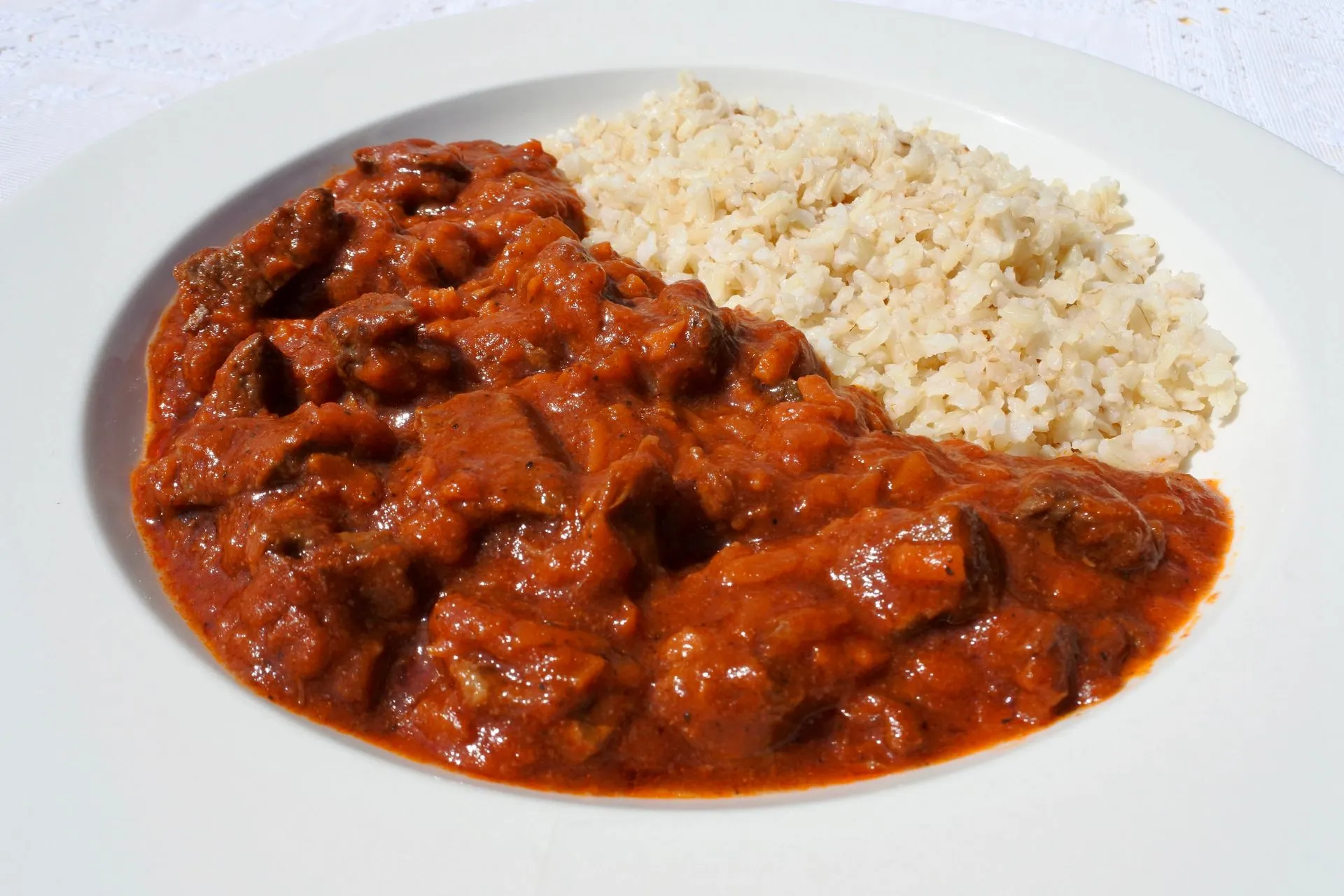 Beef stroganoff with creamy sauce and brown rice